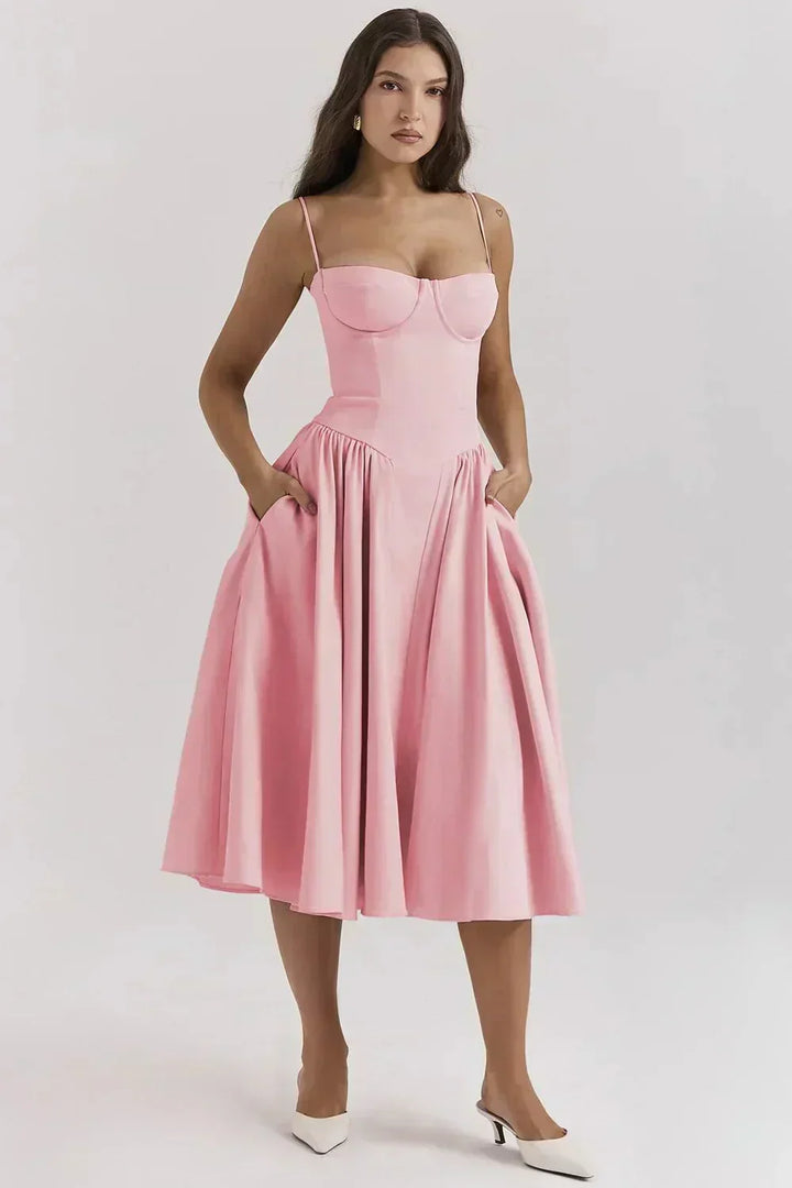 Fashionable women's A-line midi dress, featuring a structured corset for a chic wedding guest look.