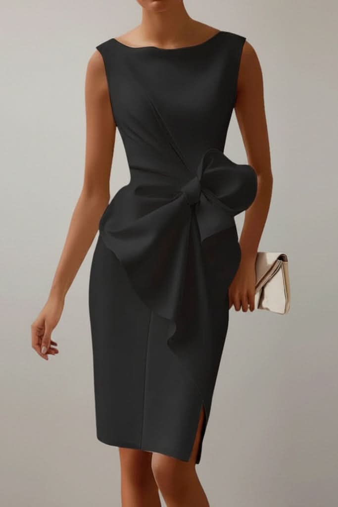 Sophisticated women's midi cocktail dress featuring an elegant design and dramatic bow back detail.