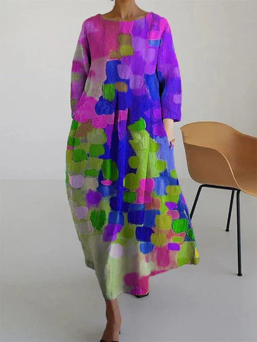 Elegant women's color-block maxi dress with long sleeves. Flowy, vibrant summer fashion for casual or statement wear.