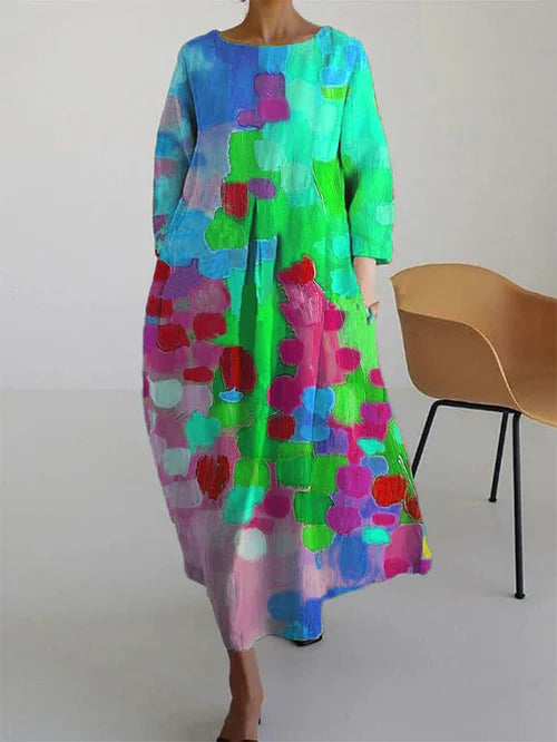 Vibrant flowy women's color-block maxi dress with long sleeves. An elegant statement piece for stylish summer fashion.