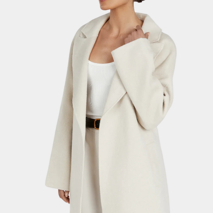 Stylish women's oversized fit long trenchcoat with an elegant belted waist, ideal for versatile outerwear fashion.