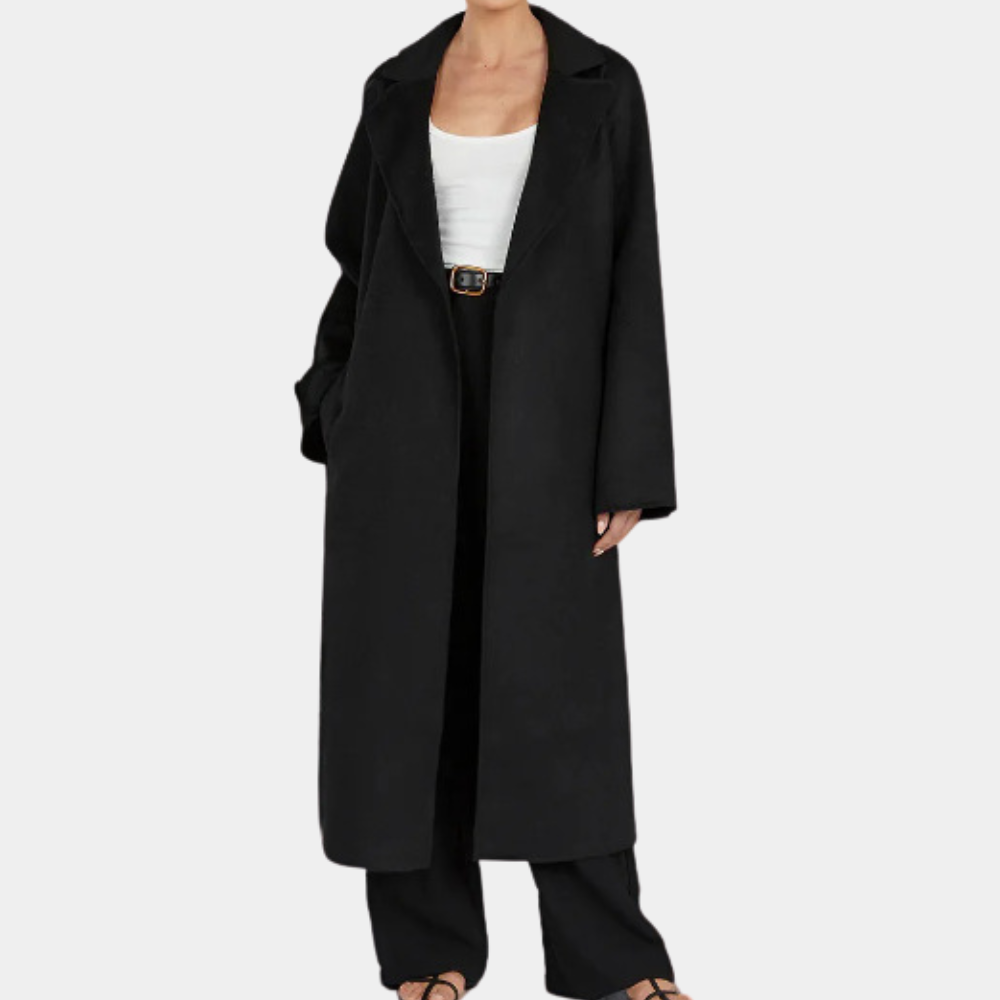 Fashionable women's long trenchcoat, oversized fit, & classic belted waist for an elegant and modern look.