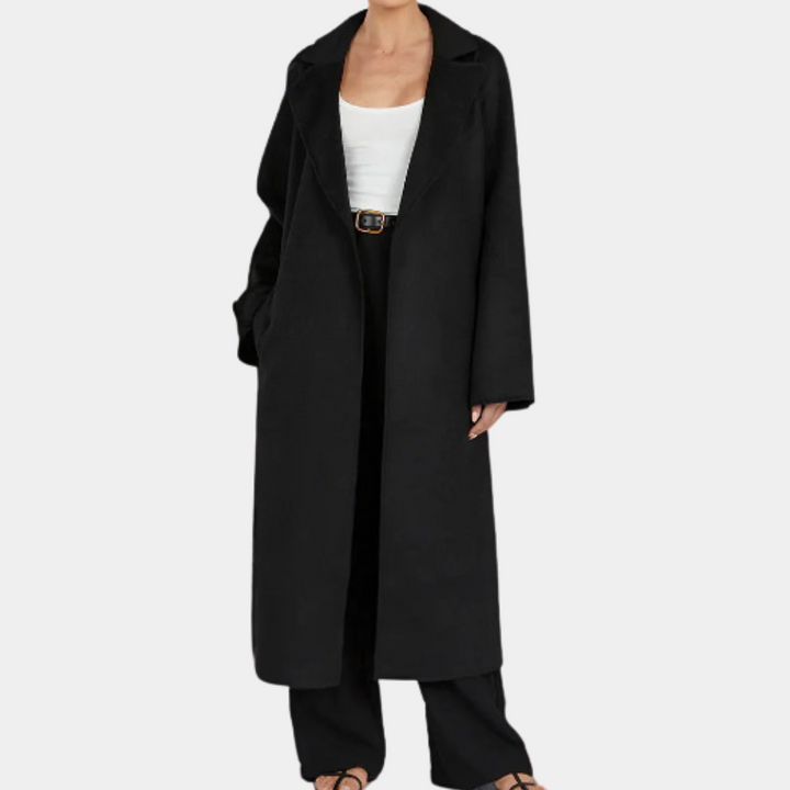 Fashionable women's long trenchcoat, oversized fit, & classic belted waist for an elegant and modern look.