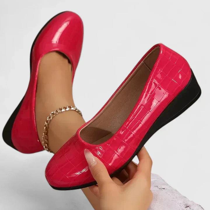 Women's sophisticated croc embossed wedge loafers with a contemporary square toe, ideal for chic daily wear.