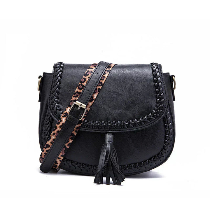 Chic black women's crossbody bag with elegant tassel detail. A versatile fashion accessory and stylish shoulder bag.