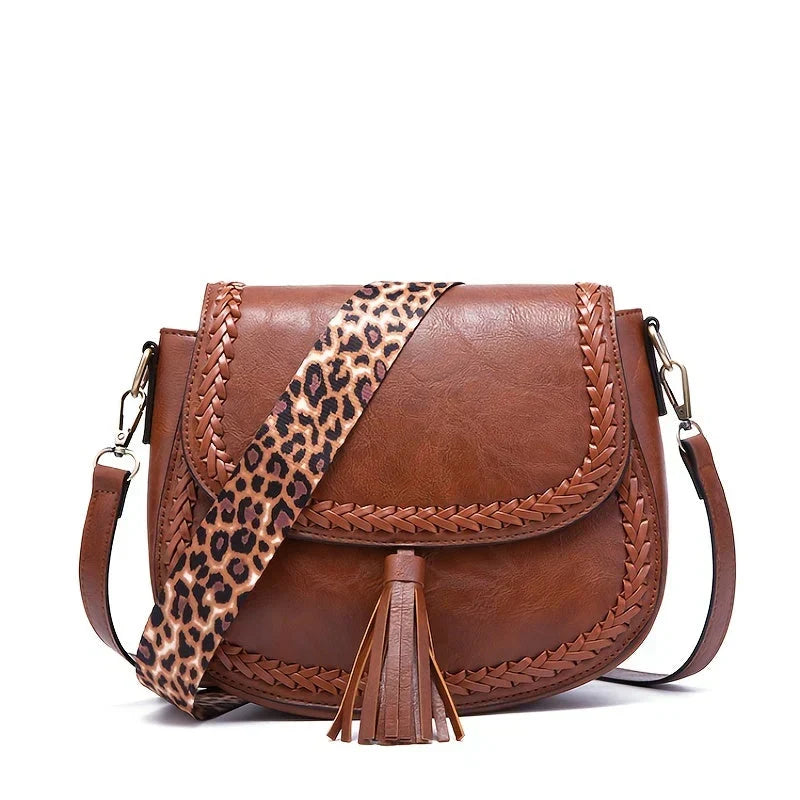 Brown elegant women's crossbody bag featuring stylish tassel. A versatile handbag and shoulder bag for daily fashion.