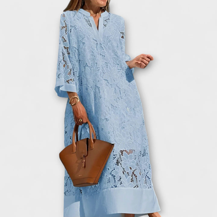 Stylish women's embroidered floral dress, short-sleeve and straight fit. Ideal for elegant occasion wear.