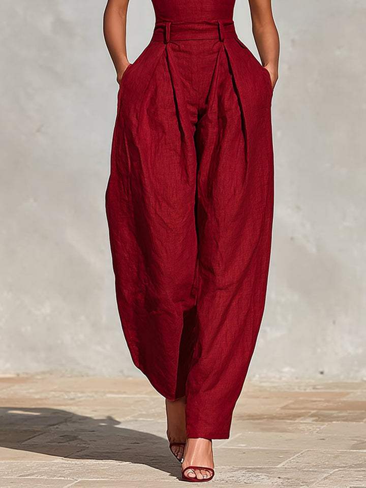 Elegant women's sleeveless deep V-neck wide leg jumpsuit, a chic choice for formal evening wear.