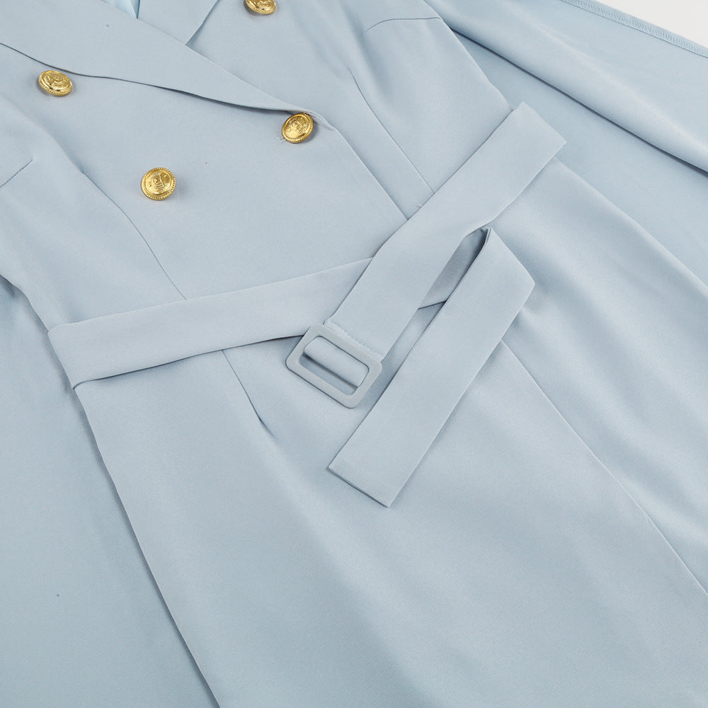 Beautifully tailored women's cape dress, double-breasted and accessorized with a belt.