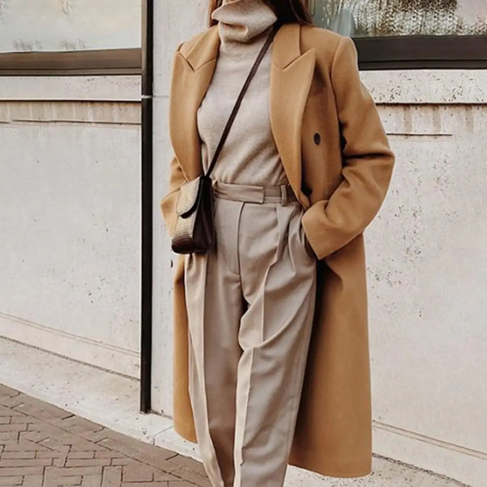 Stylish women's long double-breasted trench coat, a classic formal fall & winter outerwear piece.