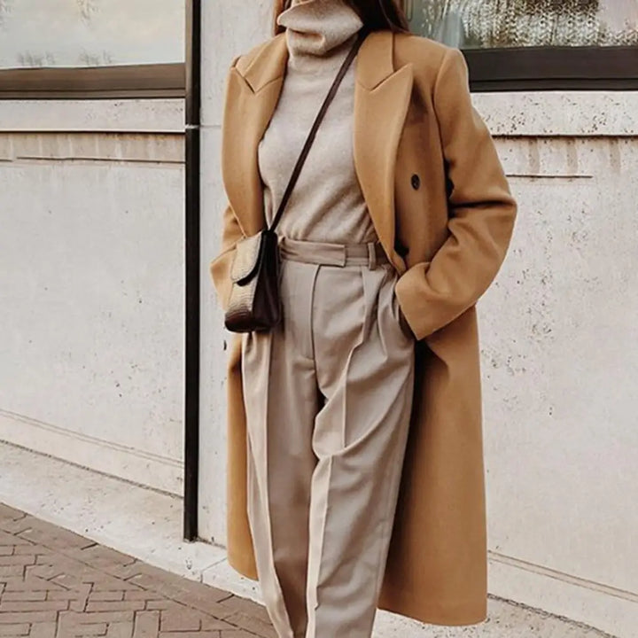 Stylish women's long double-breasted trench coat, a classic formal fall & winter outerwear piece.