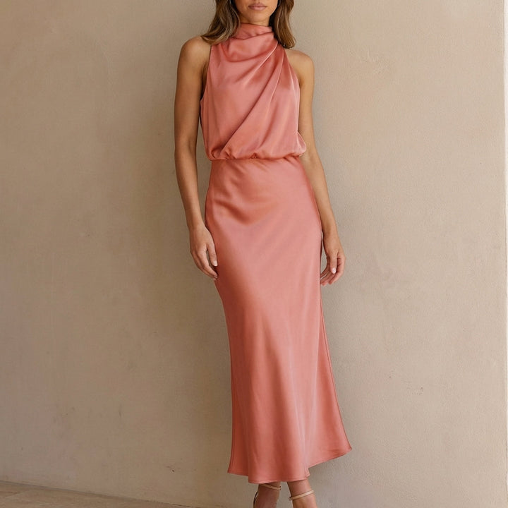 Formal women's dress, midi length, with a delicate drape, halter neck, and comfortable blouson waist.
