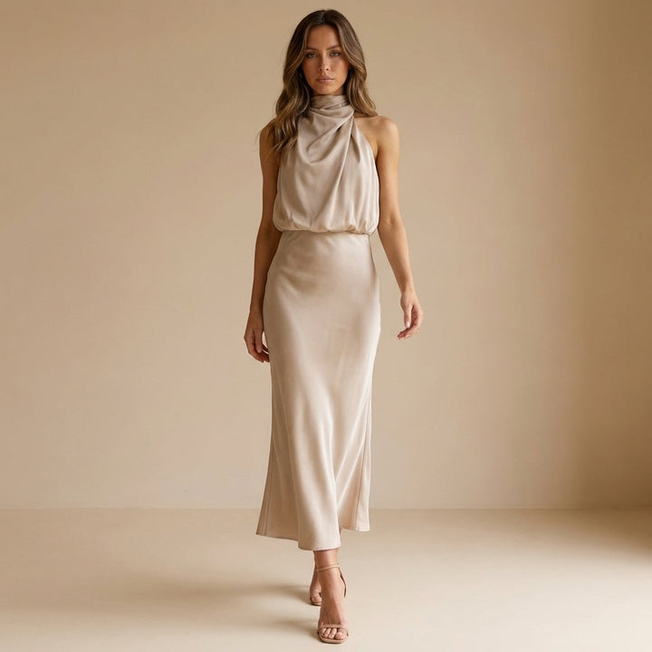 Draped halter neck midi dress for women, featuring an elegant blouson waist. Ideal for formal events.