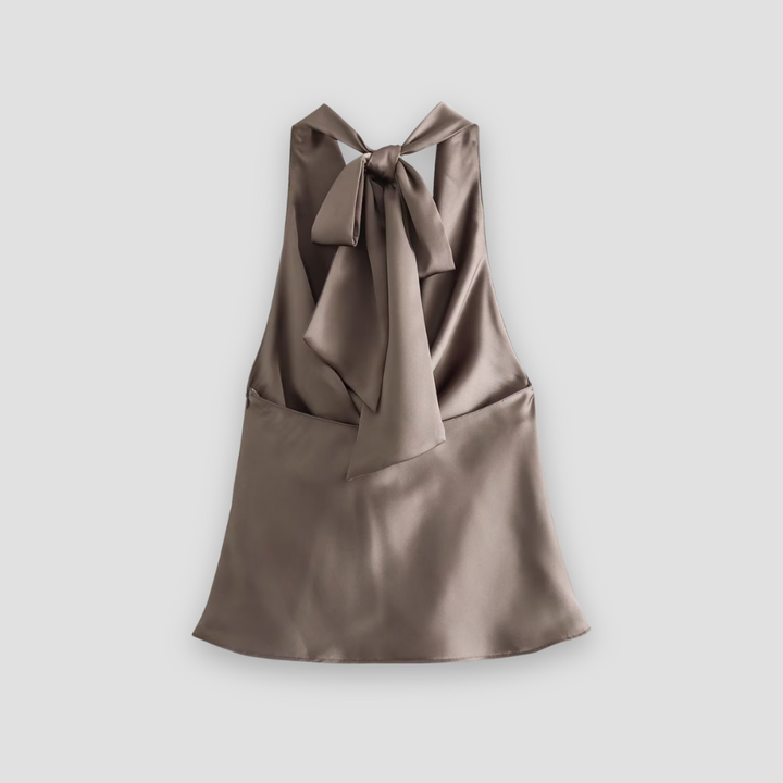 Dressy women's halter neck blouse with elegant drape, offering a chic style for evening or fashionable wear.