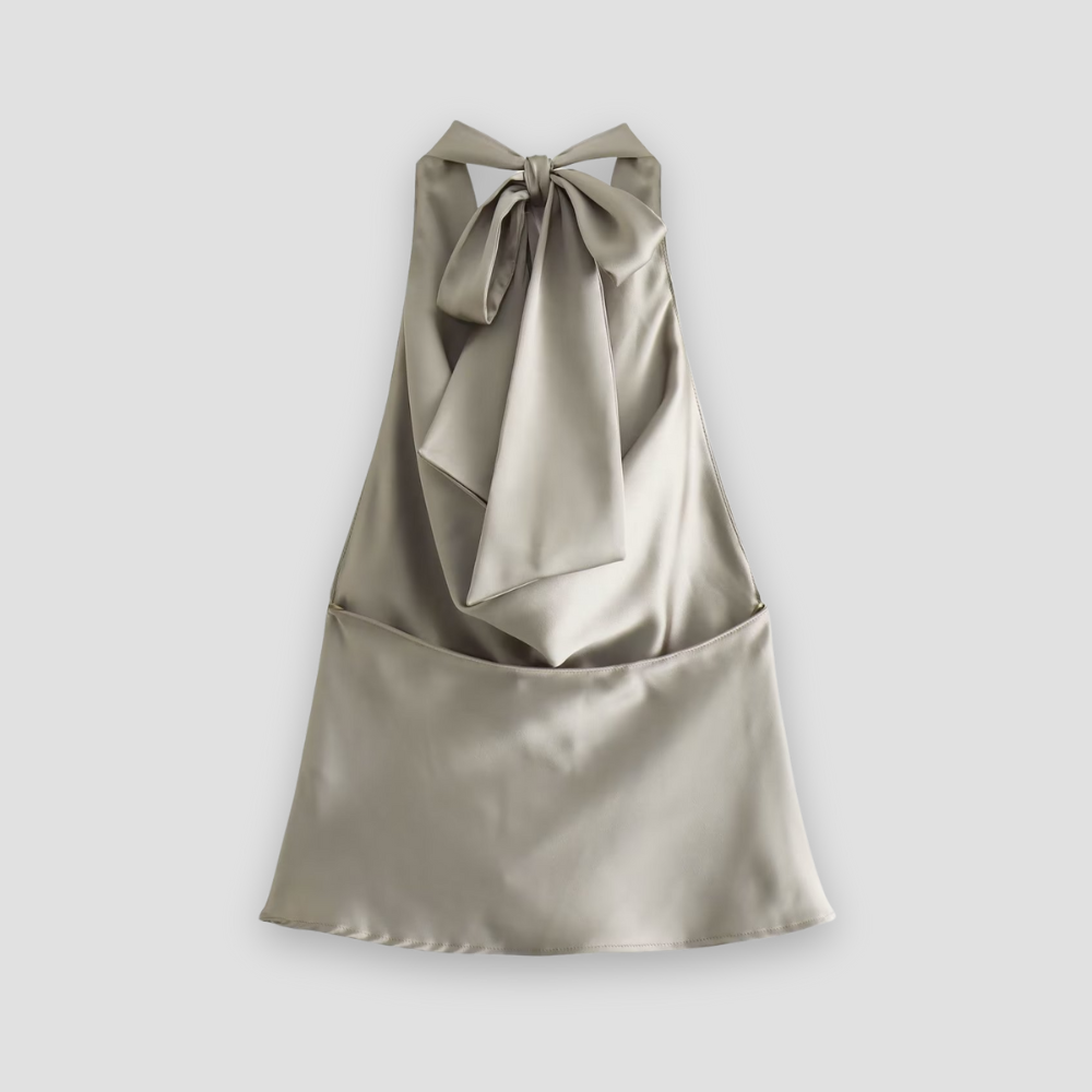 View of a women's party wear satin tank top, featuring a flattering draped halter and sleeveless cut.