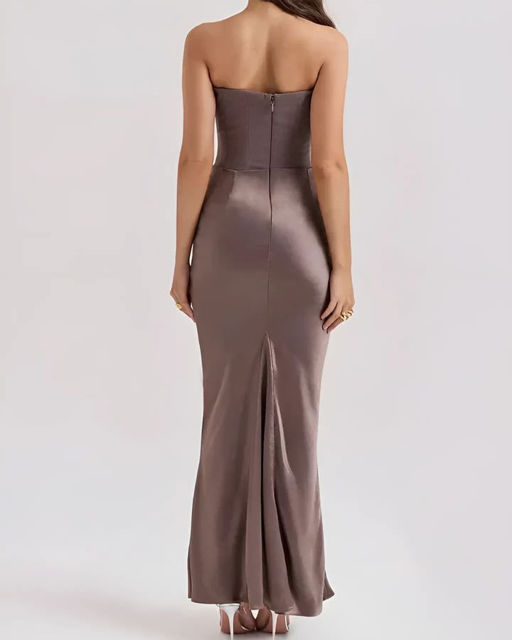 Full-length view of a sophisticated maxi dress with delicate draping, designed for a wedding guest or special occasion.