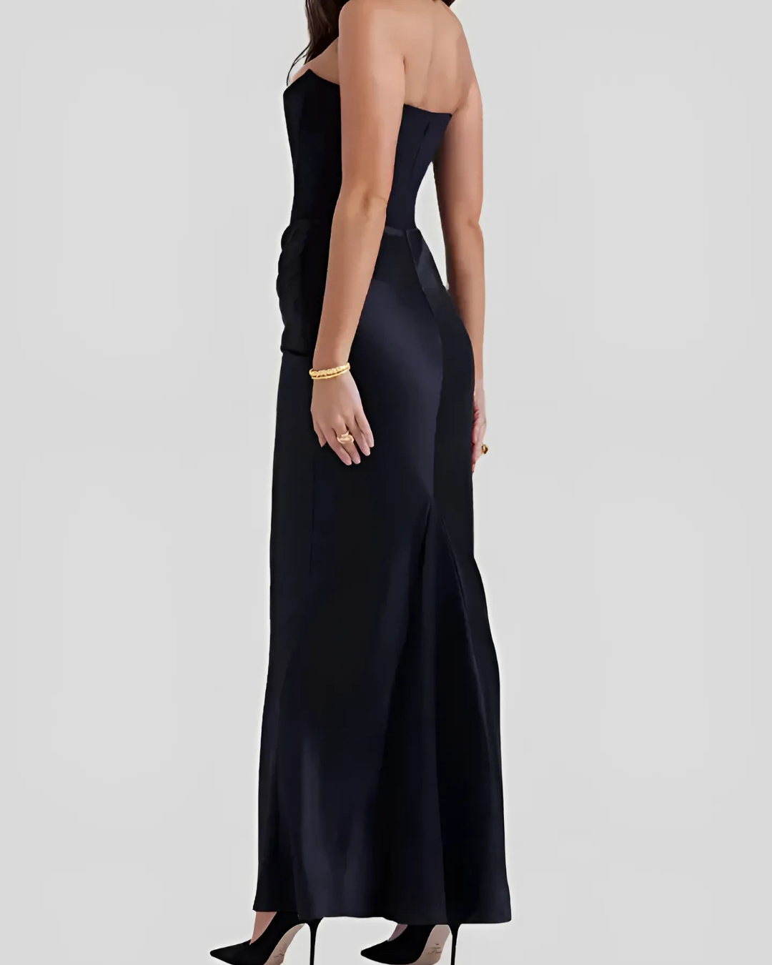 Stylish women's long dress with draped silhouette, perfect as an elegant wedding guest outfit or for formal occasions.
