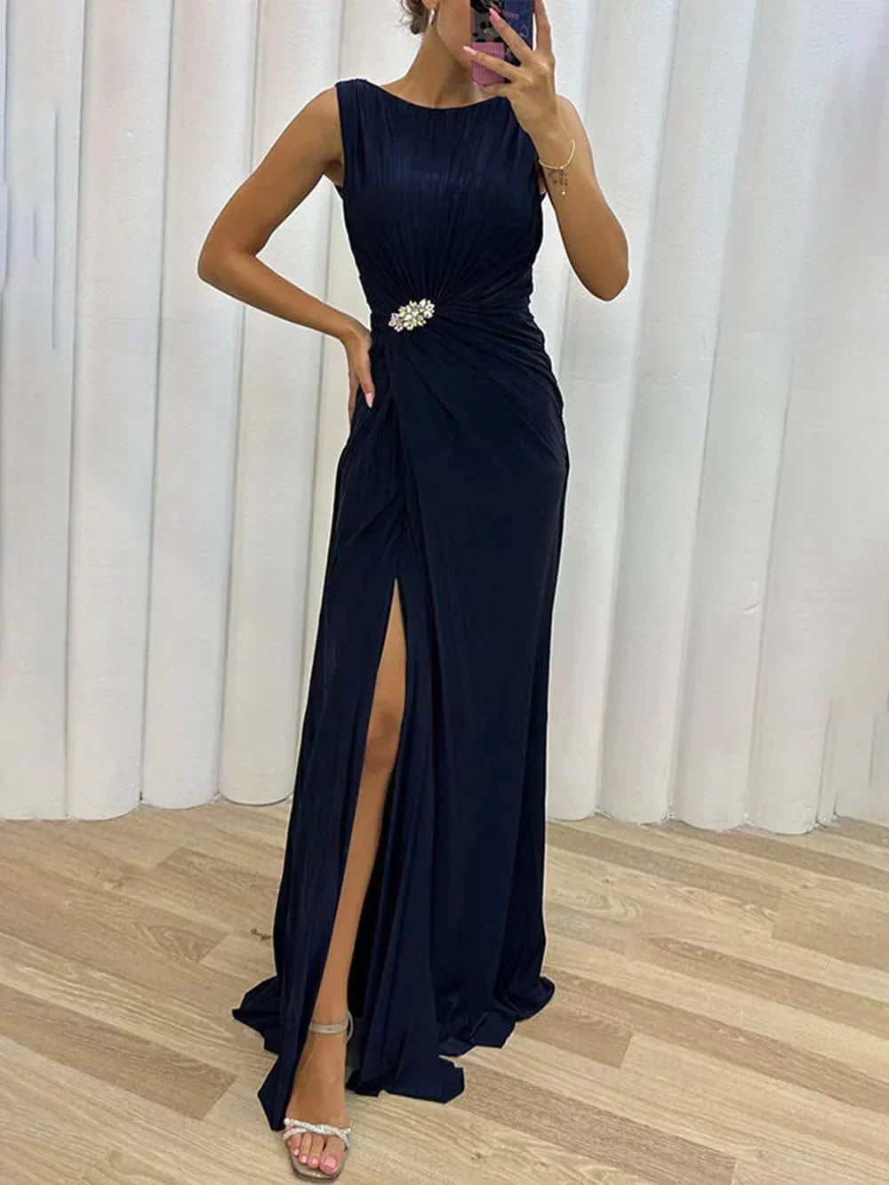 Sophisticated draped maxi dress for women, ideal as a wedding guest outfit or formal evening gown.