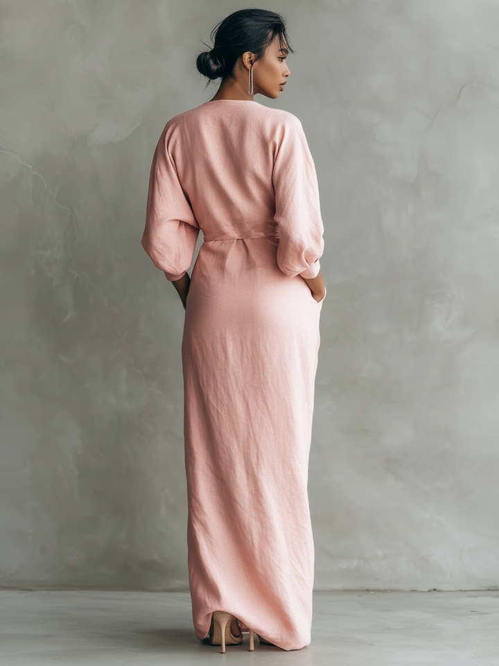 Sophisticated women's wrap maxi dress, V-neck, batwing sleeves, ideal for wedding guest attire.