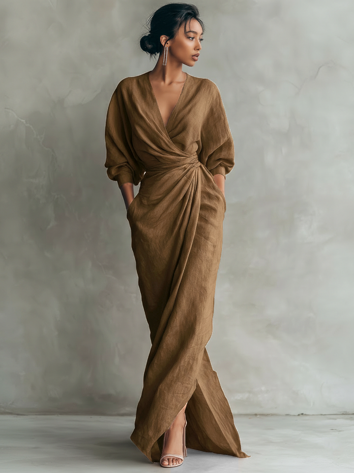 Flowy formal maxi dress for women, featuring a draped V-neck and elegant batwing sleeves.