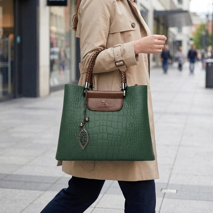 Elegant women's embossed tote bag with unique braided handle, perfect for a chic daily carryall or stylish accessory.