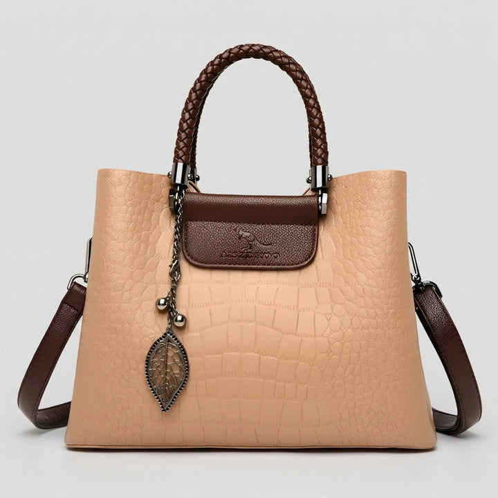 New women's embossed tote bag in classic colors, designed with a braided handle for an elegant and versatile look.