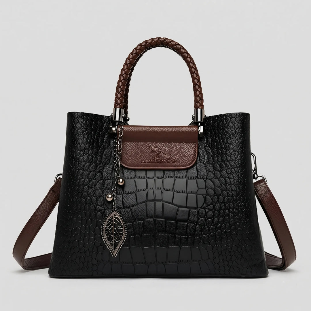 Stylish women's carryall: an embossed tote bag with an eye-catching braided handle, a chic and elegant daily accessory.