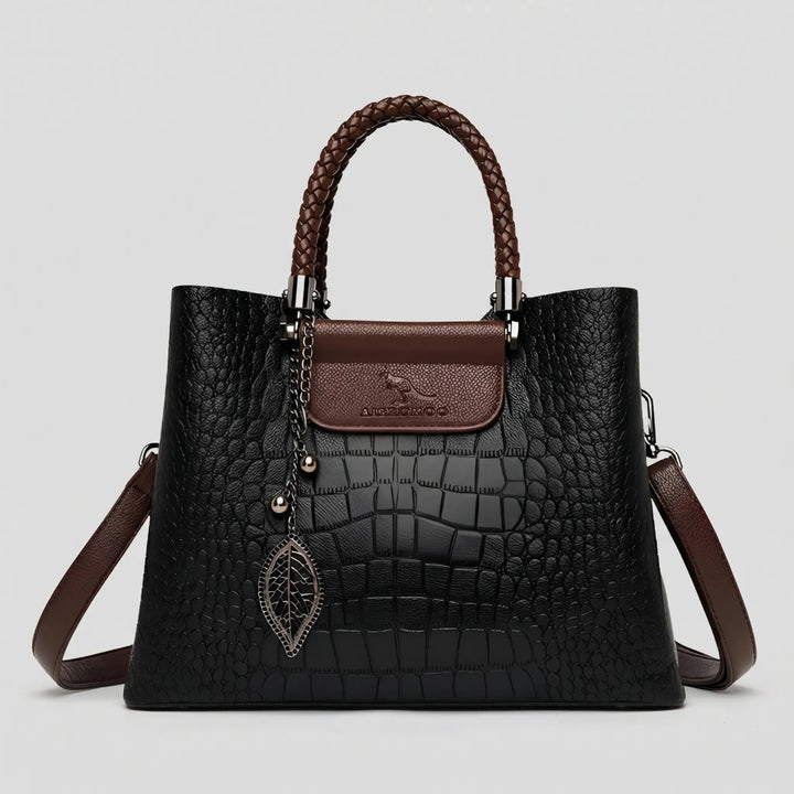 Stylish women's carryall: an embossed tote bag with an eye-catching braided handle, a chic and elegant daily accessory.