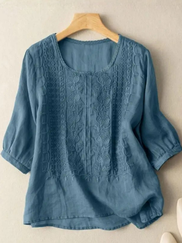 Stylish women's embroidered top with a relaxed fit, ideal for elegant casual wear and fashion-forward spring looks.