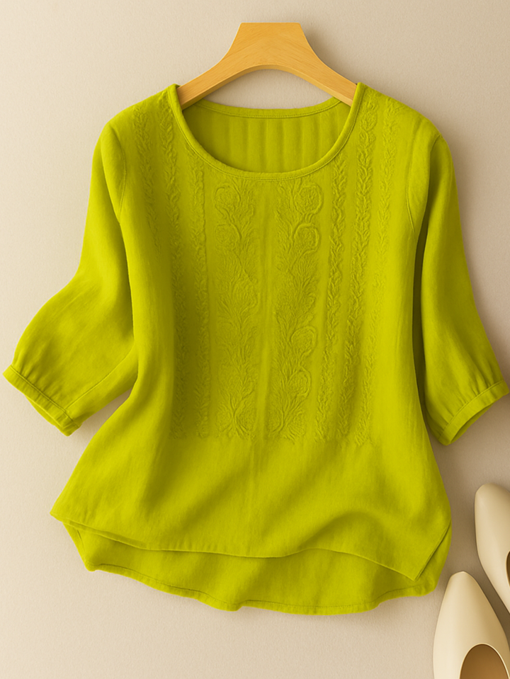 Chic women's embroidered blouse, relaxed fit, offering an elegant yet casual style for any fashionable occasion.