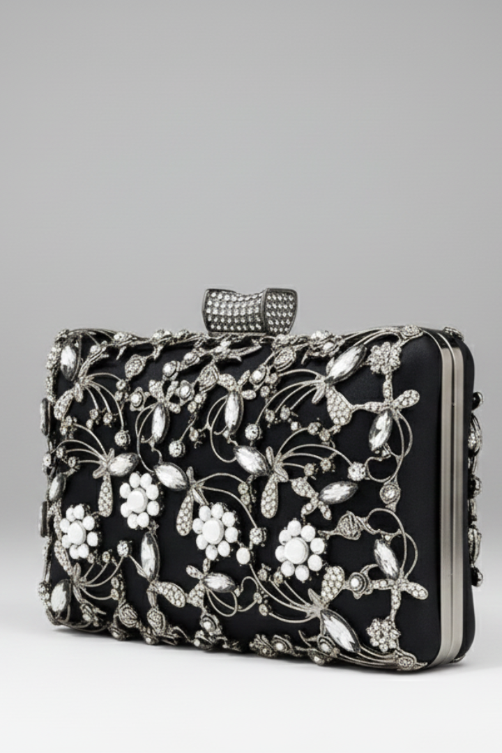 Luxury gold embroidered clutch handbag adorned with intricate decorative stones, a chic party bag for women.