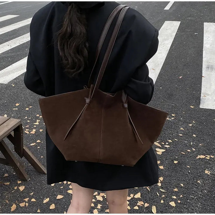 Stylish women's faux suede tote handbag, a versatile shoulder bag suitable for work and fashion.
