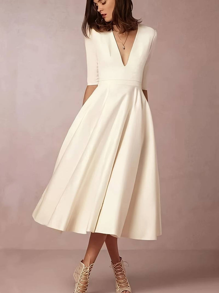 Sophisticated white flared midi dress for women, ideal for formal events
