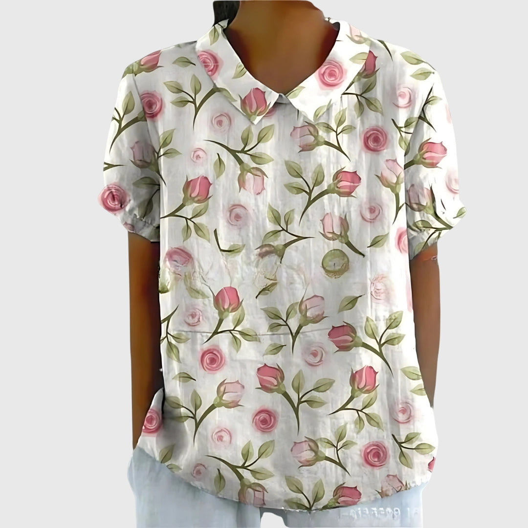 Texture detail of soft, comfortable fabric on a women's printed floral blouse, perfect for summer.