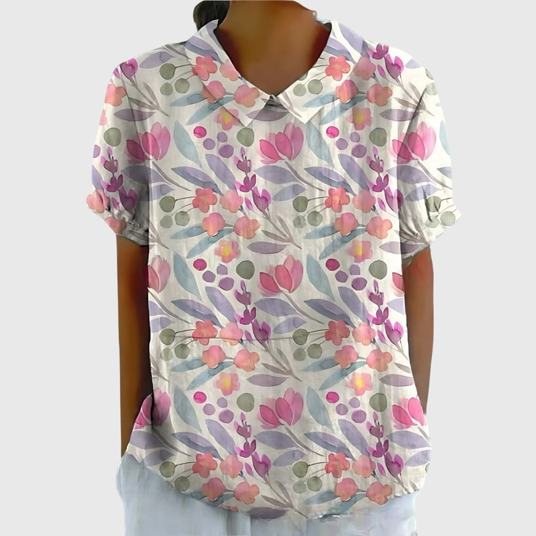 Elegant women's floral blouse, dressed up for stylish occasions, versatile for day-to-night wear.