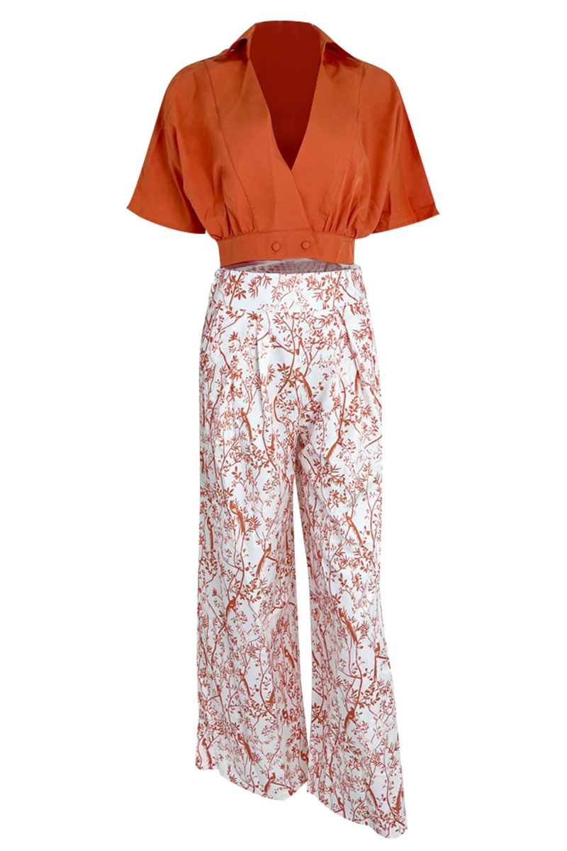 Red floral print women's crop top and high-waisted maxi skirt set, perfect elegant vacation wear.