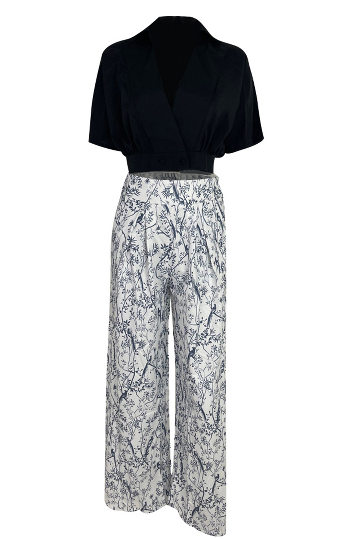 Women's sophisticated floral crop top & high-waist maxi skirt combo. Summer fashion, vacation style.