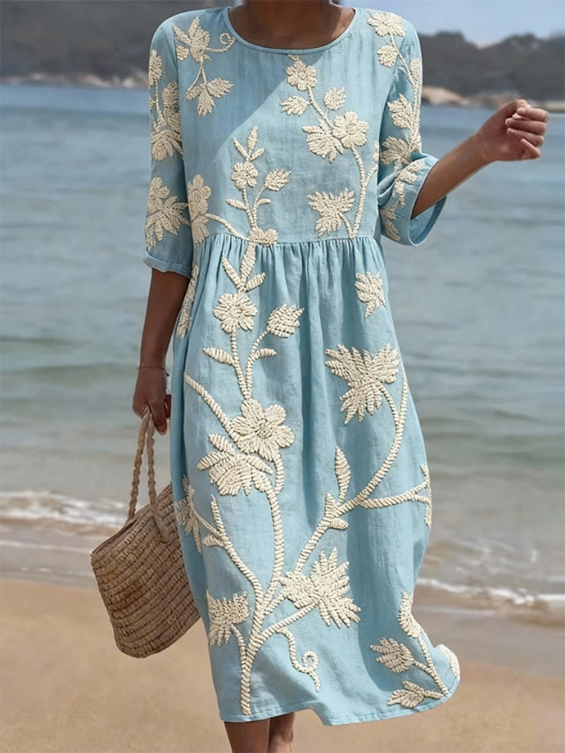 Elegant women's floral embroidered midi dress with three-quarter sleeves & round neck, ideal for summer occasions.