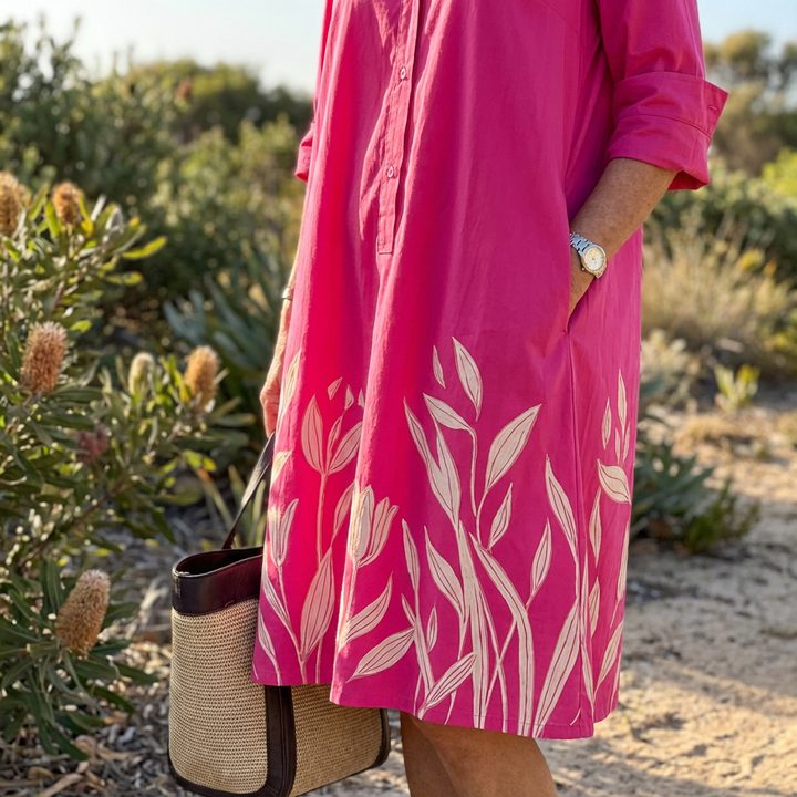 Effortlessly stylish women's luxe midi dress, richly embroidered with floral patterns for an elegant look.