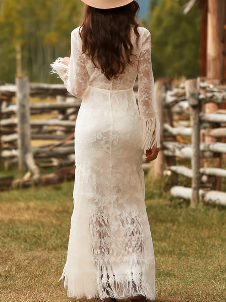 Statement women's floral fringe maxi dress. Bohemian V-neck long sleeve formal gown for an elegant look.