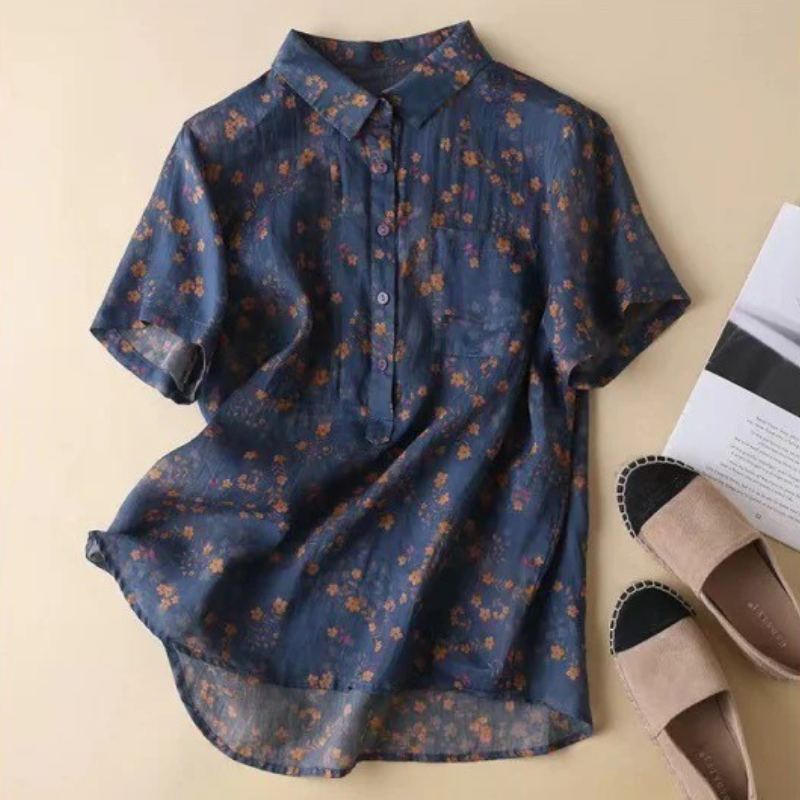 Lightweight women's floral printed blouse with a half-placket and buttons. Ideal elegant summer top for versatile fashion.