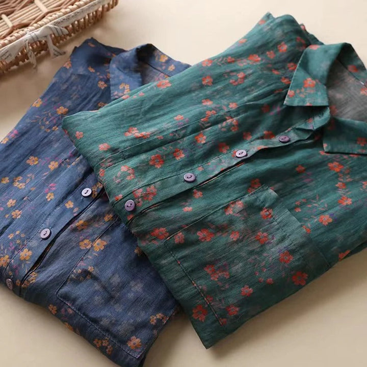 Casual women's floral button shirt featuring a half-placket. This lightweight, comfortable printed top is perfect for summer.