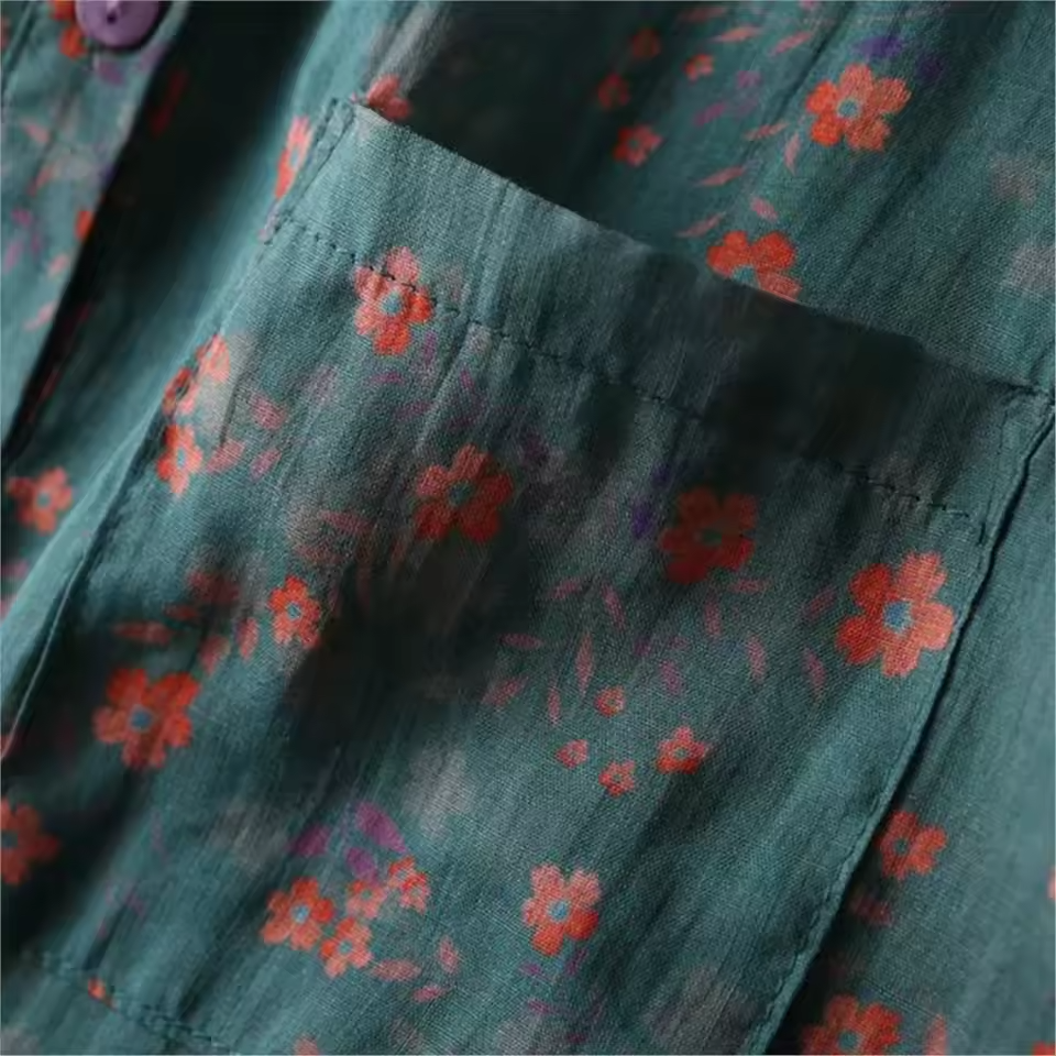 Vibrant floral print women's blouse with a stylish half-placket and buttons. A chic, lightweight summer shirt for any occasion.
