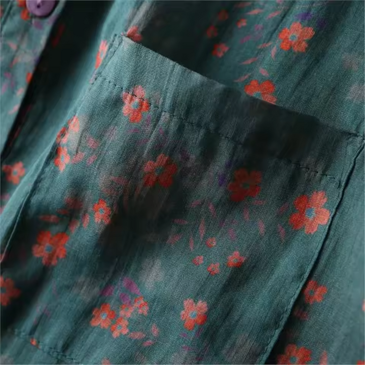 Vibrant floral print women's blouse with a stylish half-placket and buttons. A chic, lightweight summer shirt for any occasion.