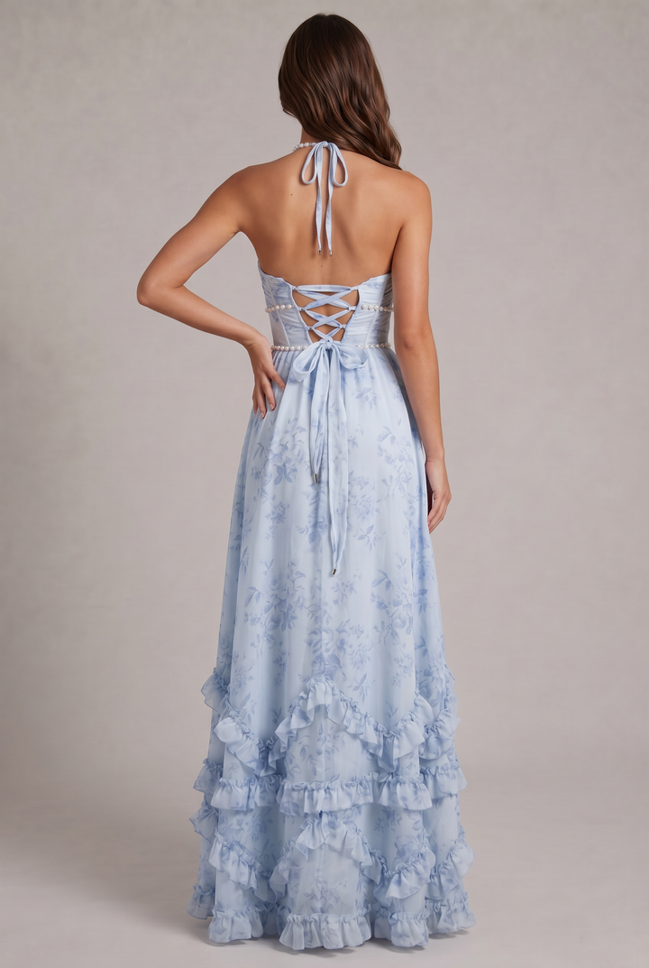 Women's elegant floral maxi dress with halter neckline & flowing pleated design. Perfect special occasion wear.