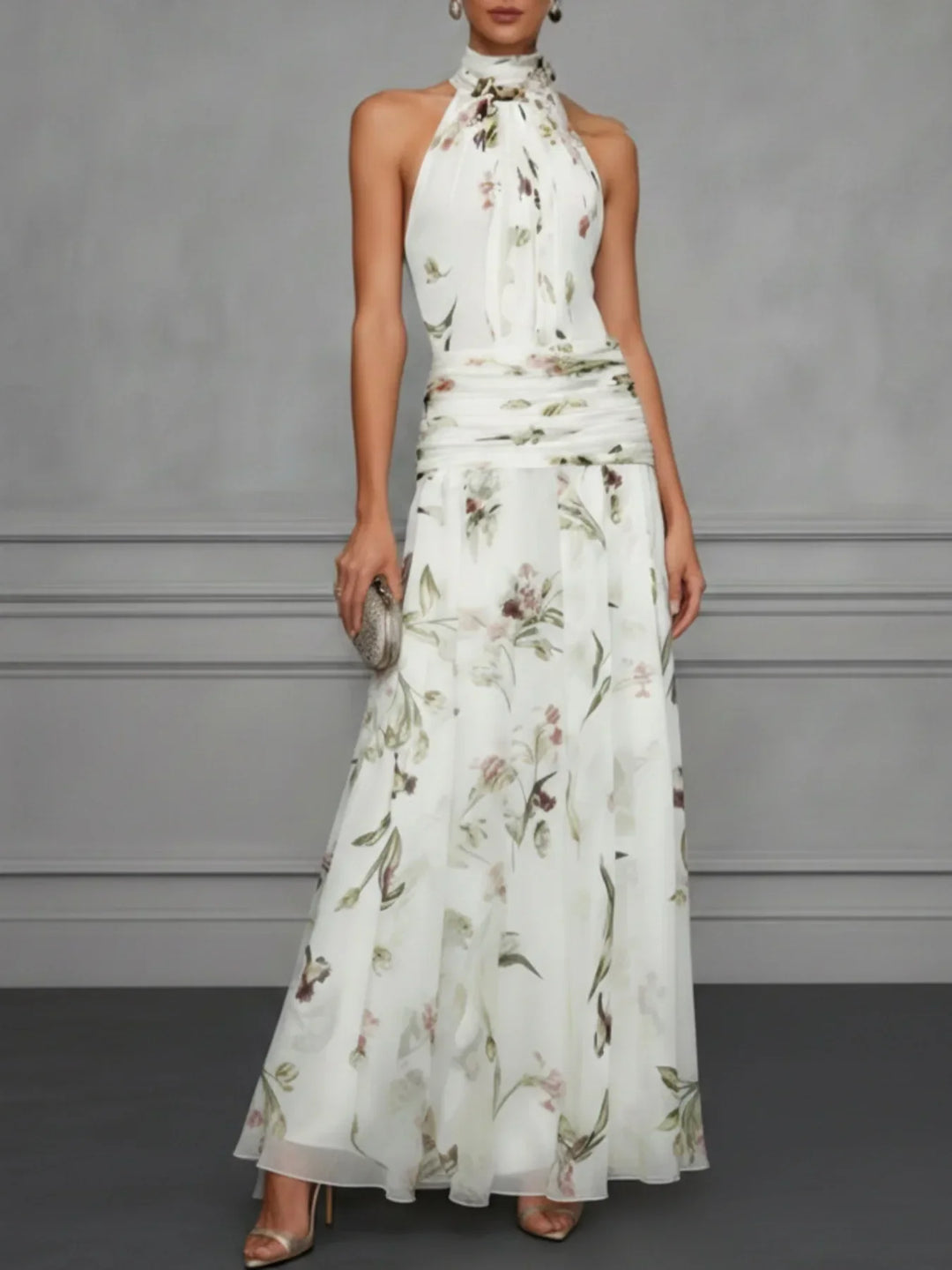 Vibrant women's floral halter maxi dress, a flowing A-line design for elegant summer event wear.