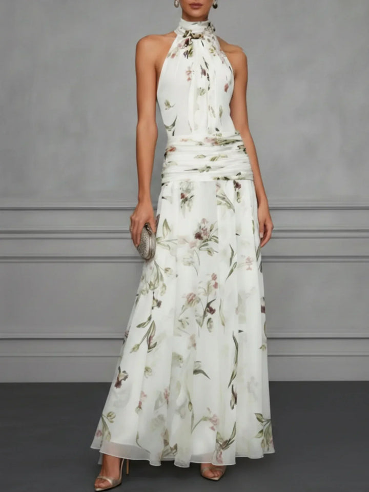 Vibrant women's floral halter maxi dress, a flowing A-line design for elegant summer event wear.