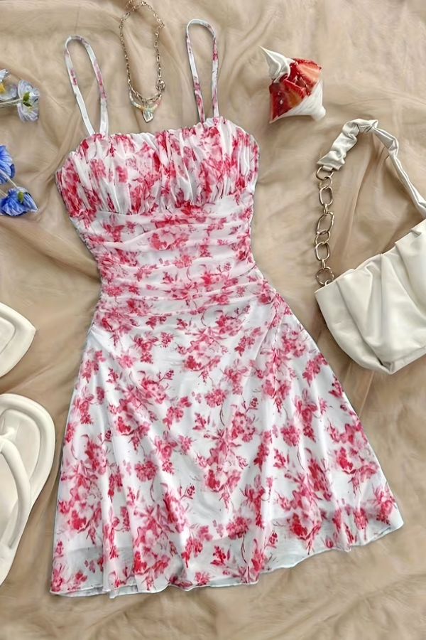 Charming floral print mini dress for women, featuring a stylish halter neck and flared hem, ideal for party wear.