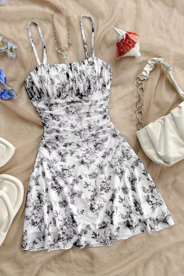 Vibrant women's floral halter mini dress, a chic and comfy vacation outfit or elegant summer party dress.