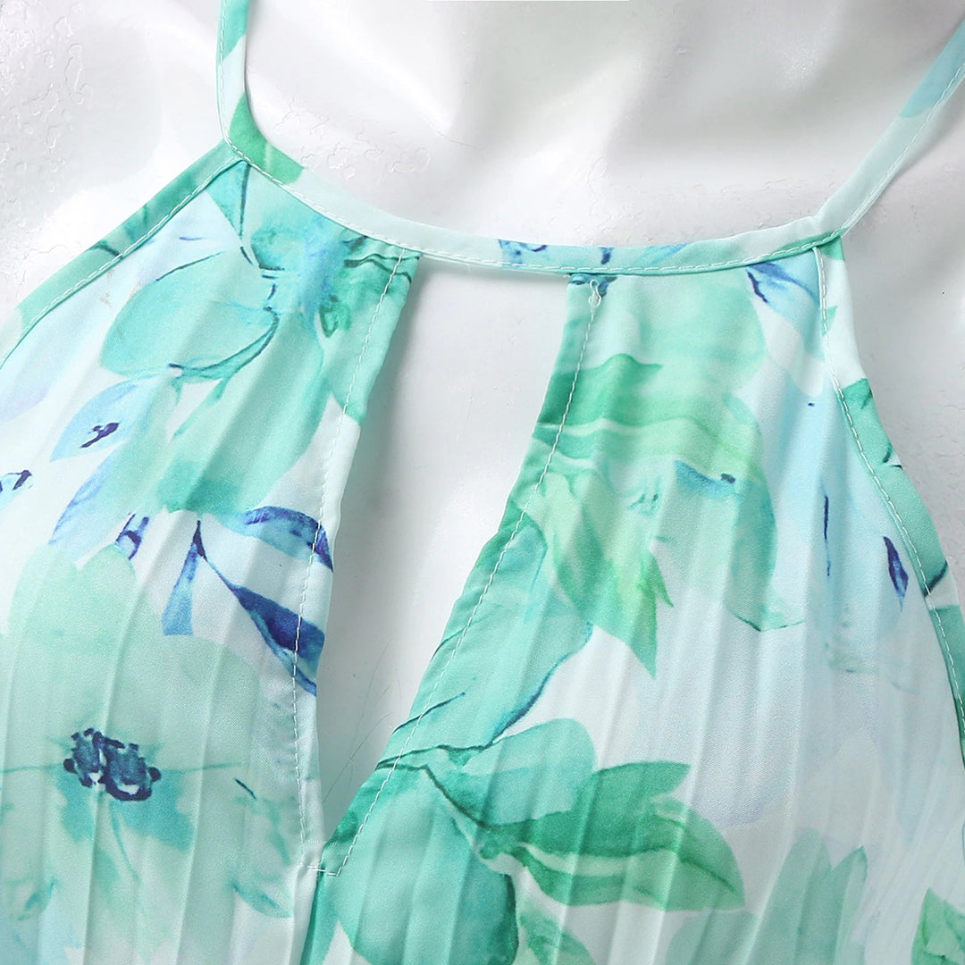 Chic women's summer maxi dress with a beautiful floral print, flattering halter neckline, and a distinctive twist waist.
